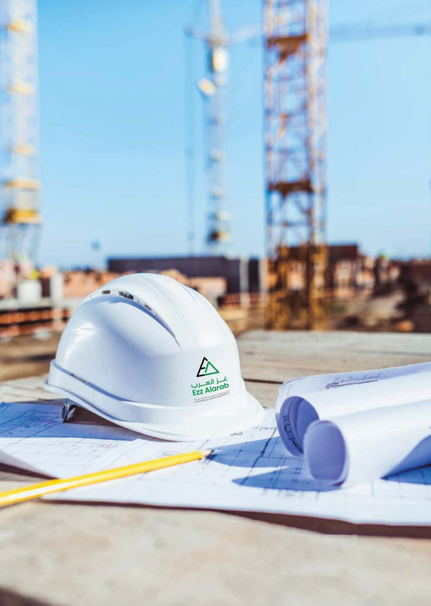 Ezz Alarab engineer's helmet and blueprints